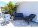 Inviting patio with comfortable seating and lush tropical landscaping for relaxing outdoor enjoyment at 817 Blue Heron Blvd, Ruskin, FL 33570