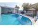 Well-appointed pool area with covered seating and dining, perfect for relaxing and entertaining guests at 817 Blue Heron Blvd, Ruskin, FL 33570