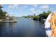 Scenic waterfront view with boat docks on a sunny day, showcasing easy access to the water at 817 Blue Heron Blvd, Ruskin, FL 33570