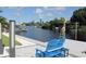 Breathtaking waterfront view with dock access and cozy seating, offering a perfect blend of comfort at 817 Blue Heron Blvd, Ruskin, FL 33570