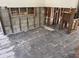 An under-construction kitchen with exposed concrete block walls, wood framing, and unfinished flooring at 9015 Bay Ne St, St Petersburg, FL 33702