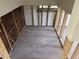 Unfinished room exhibiting bare studs and block walls ready for remodeling with a single window feature at 9015 Bay Ne St, St Petersburg, FL 33702