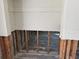 Bare interior space, primed for renovation, featuring exposed wall framing with updated wiring at 9015 Bay Ne St, St Petersburg, FL 33702
