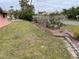 Spacious backyard with healthy lawn and well-maintained landscaping at 3604 Bula Ln, North Port, FL 34287