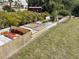 Backyard features a wooden deck and well-established tropical landscaping at 3604 Bula Ln, North Port, FL 34287