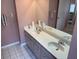 Spacious bathroom featuring double sinks, tile floors, and ample countertop space at 3604 Bula Ln, North Port, FL 34287