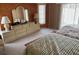 Bedroom featuring two beds, a dresser with lamps, and sliding glass doors at 3604 Bula Ln, North Port, FL 34287