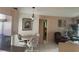Charming dining area with a round table, cozy seating, and decorative lighting at 3604 Bula Ln, North Port, FL 34287