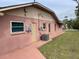 Home exterior showcasing clean lines, a back patio, and a well-kept lawn at 3604 Bula Ln, North Port, FL 34287