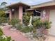 Nice exterior showing colorful landscaping, pathway to front door, and the home's address at 3604 Bula Ln, North Port, FL 34287