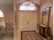Elegant front entry showcases double doors and an arched transom window at 3604 Bula Ln, North Port, FL 34287