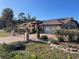 Well-maintained single-story home with a wide driveway, solar panels, mature landscaping and a two car garage at 3604 Bula Ln, North Port, FL 34287