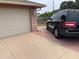 Attached garage and long driveway, next to well kept landscaping, offers convenience and ample parking at 3604 Bula Ln, North Port, FL 34287