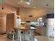 Well-lit kitchen featuring modern appliances, ample counter space, and an island with seating at 3604 Bula Ln, North Port, FL 34287
