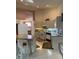 Bright kitchen featuring white appliances, ample counter space and tile flooring at 3604 Bula Ln, North Port, FL 34287