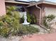 Close-up of colorful landscaping details including a mermaid statue and flower bushes at 3604 Bula Ln, North Port, FL 34287