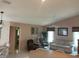 Inviting living room with a comfortable sofa, natural light, and a calming atmosphere at 3604 Bula Ln, North Port, FL 34287