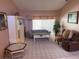 Comfortable living room features a large window and cozy seating arrangement at 3604 Bula Ln, North Port, FL 34287