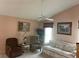 Comfortable living room featuring cozy seating, a ceiling fan, and natural light, perfect for relaxation at 3604 Bula Ln, North Port, FL 34287