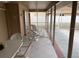 Covered and screened patio with tile floors and lounge seating at 3604 Bula Ln, North Port, FL 34287