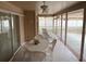 Enclosed patio with plenty of seating offering shade from the sun at 3604 Bula Ln, North Port, FL 34287
