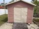 Backyard shed offers extra storage and adds charm to the property at 3604 Bula Ln, North Port, FL 34287