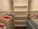 Spacious walk-in closet features shelving and hanging rods for ample storage at 3604 Bula Ln, North Port, FL 34287
