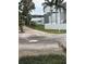 Modern architectural home with a waterfront view and tropical landscaping at 1612 Pocatello St, Sarasota, FL 34231