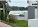 Waterfront home showcasing lush green landscaping along a tranquil river at 1612 Pocatello St, Sarasota, FL 34231