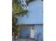 Charming blue two-story home featuring a unique round window and a welcoming front porch with a white front door at 1612 Pocatello St, Sarasota, FL 34231