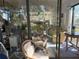 A sun-drenched living room is seen through the sliding glass doors from the deck at 1612 Pocatello St, Sarasota, FL 34231