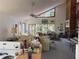Bright living room showcasing a fireplace, high ceilings, and views of nature at 1612 Pocatello St, Sarasota, FL 34231