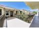 Charming condo exterior with tiled roof, light stucco walls, and landscaped walkway at 6365 Bahia Del Mar Blvd # 210, St Petersburg, FL 33715
