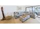 Cozy living room featuring a large sectional sofa, accent furniture, and a bright, airy atmosphere at 6365 Bahia Del Mar Blvd # 210, St Petersburg, FL 33715