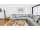 Bright living room featuring a comfortable sectional sofa, accent tables, and a clean, modern aesthetic at 6365 Bahia Del Mar Blvd # 210, St Petersburg, FL 33715