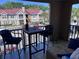 Relaxing balcony featuring a high-top table with two chairs and view of community at 9481 Highland Oak Dr # 715, Tampa, FL 33647