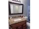 Bathroom featuring granite countertop and a large mirror at 9481 Highland Oak Dr # 715, Tampa, FL 33647