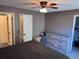 Bedroom featuring a ceiling fan, closet doors and a wooden dresser at 9481 Highland Oak Dr # 715, Tampa, FL 33647