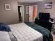 Bedroom featuring a tv, closet and a comfortable bed at 9481 Highland Oak Dr # 715, Tampa, FL 33647