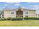 Inviting two-story condominium building with well-maintained landscaping and a charming facade at 9481 Highland Oak Dr # 715, Tampa, FL 33647