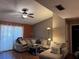 Cozy living room with comfortable sectional sofa, ceiling fan, and plenty of natural light at 9481 Highland Oak Dr # 715, Tampa, FL 33647