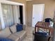 Patio with outdoor seating and a sliding door entrance at 9481 Highland Oak Dr # 715, Tampa, FL 33647