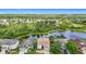 Breathtaking community aerial view featuring serene lakes, lush greenery, and well-spaced homes at 18441 New London Ave, Land O Lakes, FL 34638