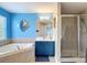 Beautiful bathroom with soaking tub and glass-enclosed shower at 18441 New London Ave, Land O Lakes, FL 34638