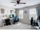 This bedroom boasts natural light with large windows and gray walls, creating a serene and inviting atmosphere at 18441 New London Ave, Land O Lakes, FL 34638