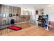 Bonus room featuring laminate flooring, a workout space, a bar, and arcade games at 18441 New London Ave, Land O Lakes, FL 34638