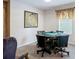 Cozy game room featuring poker table, patterned chairs, and window at 18441 New London Ave, Land O Lakes, FL 34638