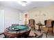 Game room featuring poker table, patterned chairs, and modern decor at 18441 New London Ave, Land O Lakes, FL 34638
