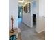Hallway with carpeted floor, neutral walls, and an art display at 18441 New London Ave, Land O Lakes, FL 34638