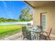 Covered patio with a serene view of the pond at 18441 New London Ave, Land O Lakes, FL 34638